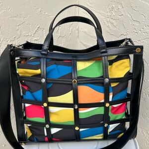 STAUD Emma tote bag with a multi-color patterned insert.